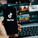 diminuir o áudio do TikTok